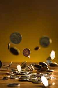 silver-golden-coins-falling-coins-wooden-wall1